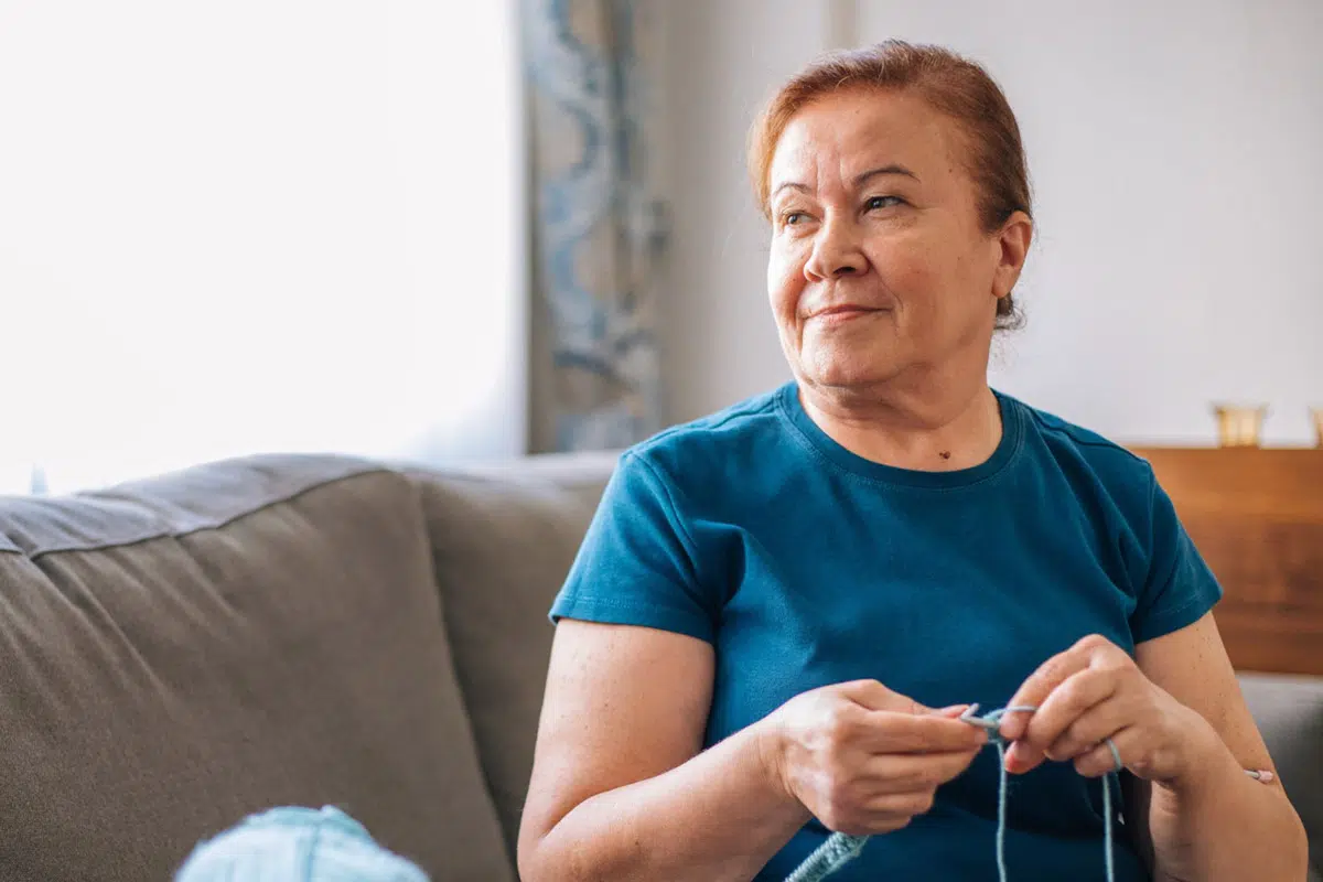 Older woman knitting